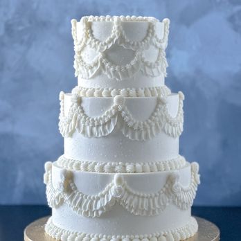 Love + Sugar - Three-tier vintage style wedding cake with Lambeth design. Plan your cake to match your dreams with Love + Sugar. Schedule a tasting today! - Custom Cakes Near Me