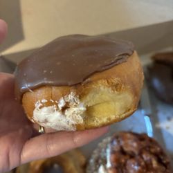Dk Donuts & Burgers - White cream filled, chocolate-iced donut