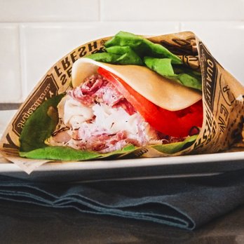 Montecito Gourmet - a sandwich wrapped in paper - Delis Near Me - Santa Barbara, California Montecito Gourmet - a sandwich wrapped in paper - Delis Near Me - Santa Barbara, California