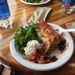 Chicken burrito, includes lettuce, sour cream, and tomatoes. The burrito had beans, cheese, and chicken. Absolutely delicious =) Chicken burrito, includes lettuce, sour cream, and tomatoes. The burrito had beans, cheese, and chicken. Absolutely delicious =)