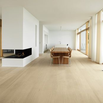 Integrity Flooring - a dining room with a fireplace - Flooring Near Me