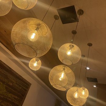 Prime Pub - a row of light bulbs hanging from the ceiling - Gastropubs Near Me - Somers, New York