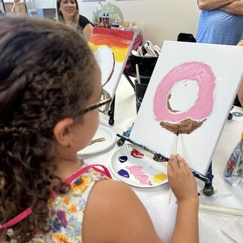 Painting with a Twist - Kendall - Girl painting a donut - Art Classes Near Me - Miami, Florida Painting with a Twist - Kendall - Girl painting a donut - Art Classes Near Me - Miami, Florida