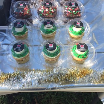 Sweet Relief - a table of cupcakes with frosting - Bakeries Near Me Sweet Relief - a table of cupcakes with frosting - Bakeries Near Me
