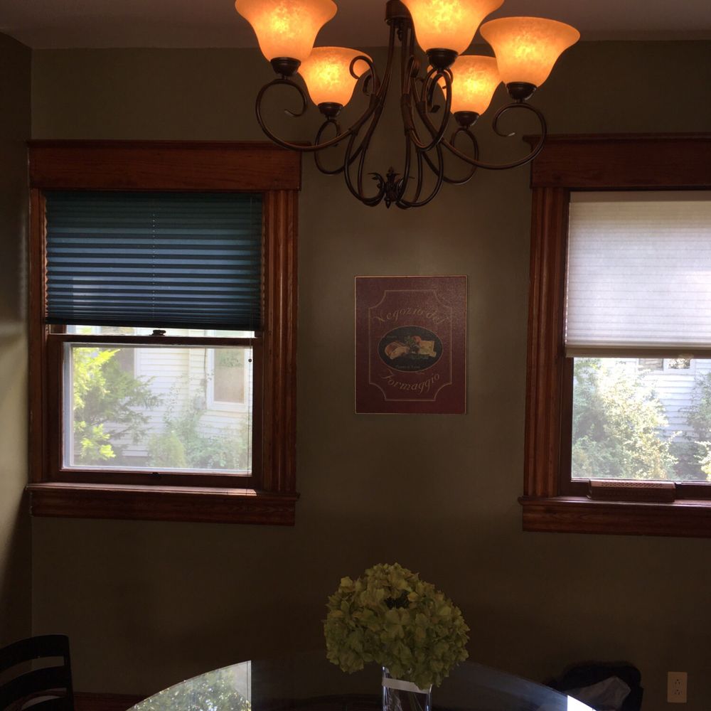 a dining room with a chandelier a dining room with a chandelier