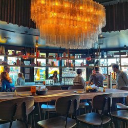 Postino Boulder - Community table, bar behind