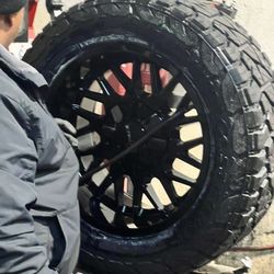 Save Big On Tires - Tire getting mounted to fresh enthuze 20" rims