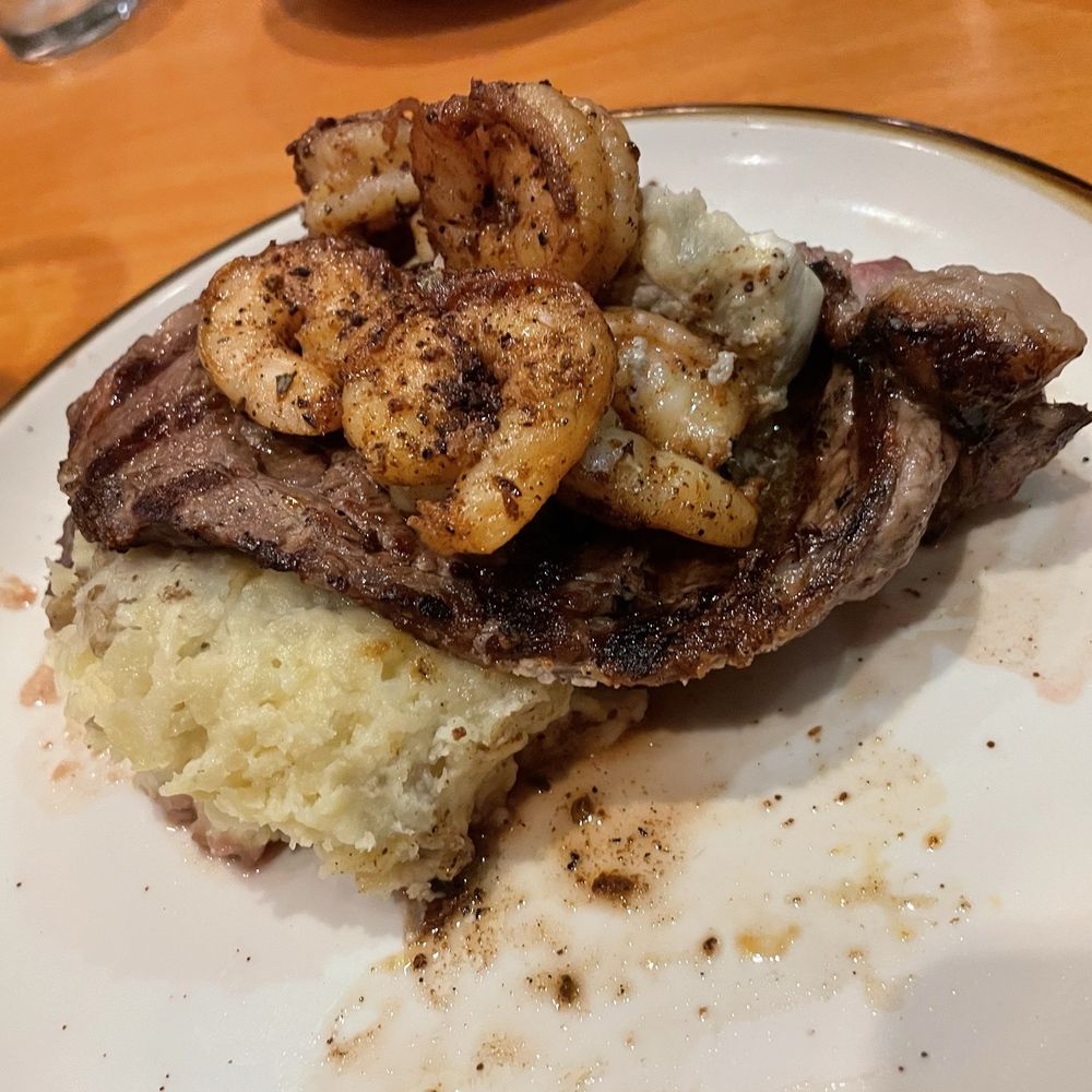Ribeye with garlic mashed potatoes and I added the side of blackened shrimp Ribeye with garlic mashed potatoes and I added the side of blackened shrimp