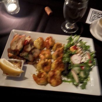 Penumbra - Blurry picture of the delicious creole shrimp entree. It was so good! - Wine Bars Near Me - Chicago, Illinois