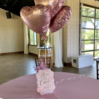 Lost Oak Winery - a pink table with a pink tablecloth and balloons - Party & Event Planning Near Me - Burleson, Texas