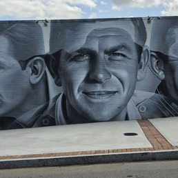 Mural of Andy thru his career.   Artist spray painted this in 2 weeks.