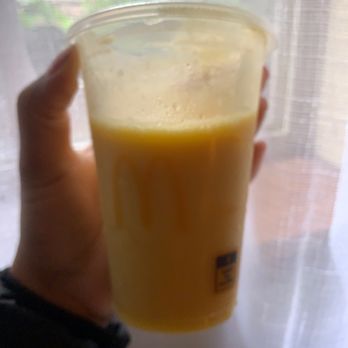 McDonald's - a hand holding a cup of orange juice - Fast Food Near Me - Federal Way, Washington McDonald's - a hand holding a cup of orange juice - Fast Food Near Me - Federal Way, Washington