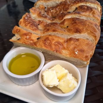 Two Sisters Vineyards - Herb house made crusty bread with olive oil and butter - Wine Tours Near Me - Niagara-on-the-Lake, Ontario Two Sisters Vineyards - Herb house made crusty bread with olive oil and butter - Wine Tours Near Me - Niagara-on-the-Lake, Ontario