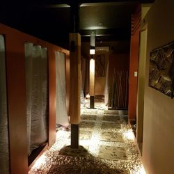 Crown Garden Spa - Hallway with massage and Body scrub rooms and dim lights.