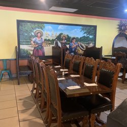 El Cancun - Mural in dining room. Comfortable chairs and booths.