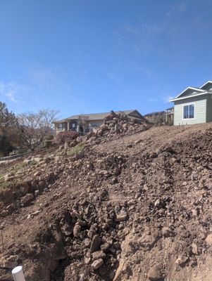 Golden hawk Rock project - removed Rock re-sloped grade on Hill still have to go back for customer and do more work to finish French drains etc Golden hawk Rock project - removed Rock re-sloped grade on Hill still have to go back for customer and do more work to finish French drains etc