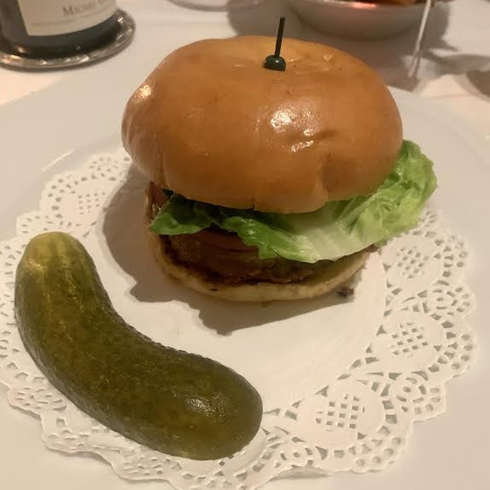 Corner Bar - Corner Bar burger with smoked-onion remoulade, pickles, and New York cheddar - New American Near Me - New York, New York