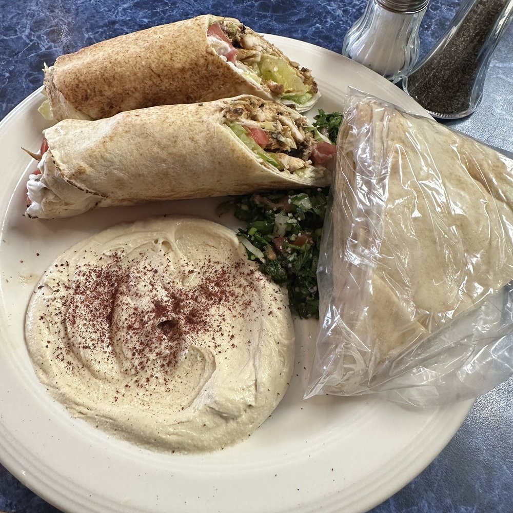 Chicken tawook sandwich combo meal, with tabbouleh and hummus (comes with extra pita) Chicken tawook sandwich combo meal, with tabbouleh and hummus (comes with extra pita)