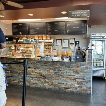 El Carrusel Bakery - a man standing in front of a counter - Salvadoran Near Me - Los Angeles, California El Carrusel Bakery - a man standing in front of a counter - Salvadoran Near Me - Los Angeles, California