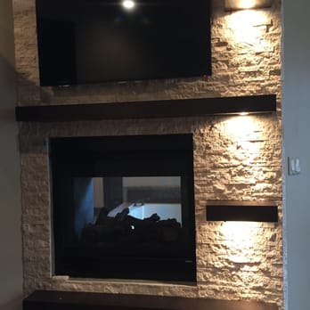 Media Madnez - TV hang above the fireplace - Home Theatre Installation Near Me Media Madnez - TV hang above the fireplace - Home Theatre Installation Near Me
