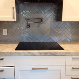Here is a photo of our herringbone pattern kitchen backsplash.