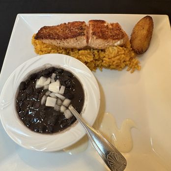 Brian's Place - This was the crispy, seared salmon, the plantain, yellow rice, and black beans very good - Spanish Near Me - Hernando Beach, Florida