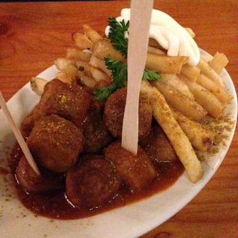 Reichenbach Hall - Curry Wurst - sliced grilled bratwurst in tomato based curry sauce, with fries & mayo - Bars Near Me - New York, New York Reichenbach Hall - Curry Wurst - sliced grilled bratwurst in tomato based curry sauce, with fries & mayo - Bars Near Me - New York, New York
