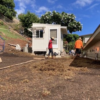 Aloha Hydroseed - two men working on a house - Landscaping Near Me