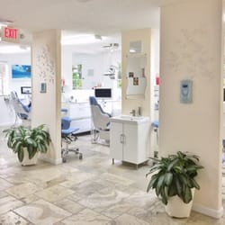 A naturally lit office. Comfortable space and patients have the view to the private outside area through big windows.