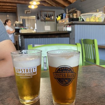 The Malpeque Oyster Barn - two glasses of beer - Seafood Near Me - Malpeque, Prince Edward Island The Malpeque Oyster Barn - two glasses of beer - Seafood Near Me - Malpeque, Prince Edward Island