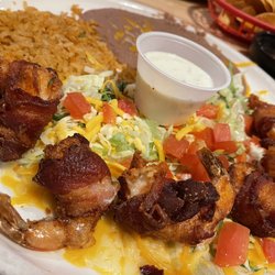 Mexican house - Bacon wrapped shrimp dipped in queso is the bomb