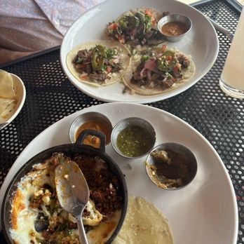 Redbird Scratch Kitchen + Bar - Sam Hughes - The carne asada tacos and the remnants of the queso fundido. - Cocktail Bars Near Me - Tucson, Arizona