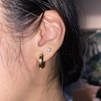 Sideshow Tattoo and Piercing - 2nd lobe piercing by Isaac - Tattoo Near Me - San Diego, California Sideshow Tattoo and Piercing - 2nd lobe piercing by Isaac - Tattoo Near Me - San Diego, California