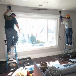 A M Green Construction - Running the wiring necessary for wall-mounted speakers and a subwoofer. - General Contractors Near Me - Berkeley, California