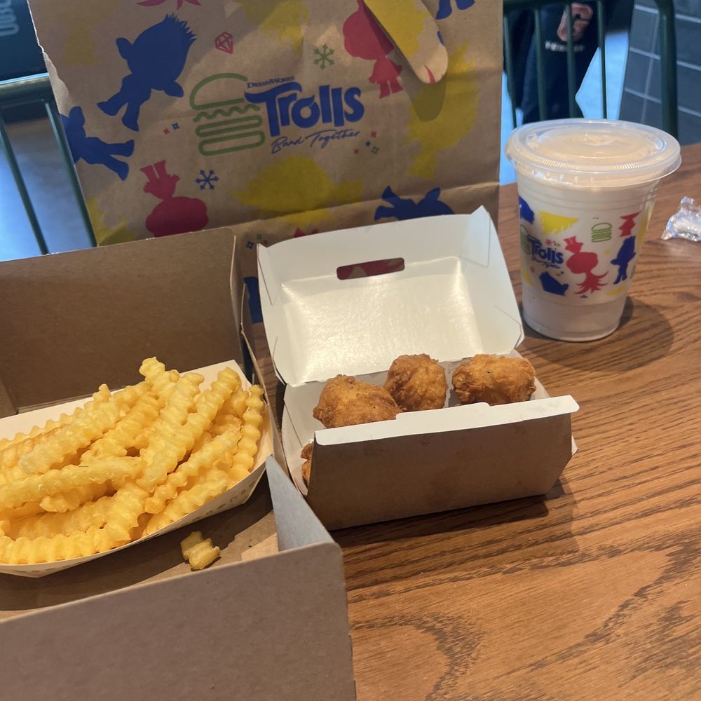 Chicken bites n fries with black n white small shake. Chicken bites n fries with black n white small shake.