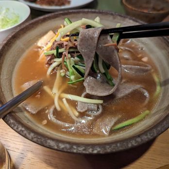 Genesis House - Buckwheat Knife Noodle, Hand Torn Beef Brisket, Zucchini, Egg Ribbons, Beef Broth - Korean Near Me - New York, New York