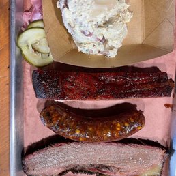 Brisket, sausage, pork rib and potato salad Brisket, sausage, pork rib and potato salad