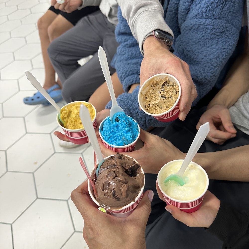 a group of people eating ice cream