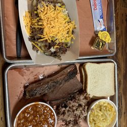 Mac's Barbeque - Loaded Bake Potato &  3 meat combo Rib, brisket and pulled pork. Along with bread pudding.....Good stuff!!