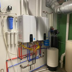 Tankless water heater with water softener infiltration set up by Sharp Water Solutions