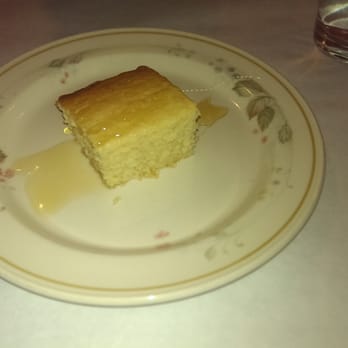 Southern Kitchen - Complimentary sample of cornbread, drizzled with honey. - Southern Near Me - Richmond, Virginia