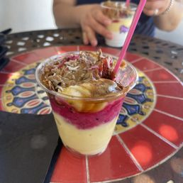 Passion Fruit, Pitaya base with bananas, strawberries, granola, chia seeds, honey, almond butter, coconut shreds