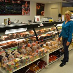 PV Euro Market - Georgia (owner) next to the great selection of hearty old world style breads that are delivered daily.