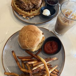 Chicken and waffles & Shrimp sandwich with fries with French vanilla cold brew and chai latte with lavender honey syrup.