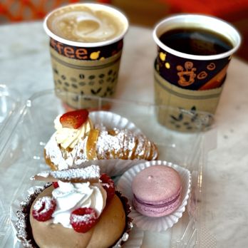 DOLCE & AMARO ARTISAN BAKERY - Mini lobster tail, a full-size raspberry chocolate tart, a raspberry macaron, a cappuccino, and an Americano - Bakeries Near Me - Greensboro, North Carolina DOLCE & AMARO ARTISAN BAKERY - Mini lobster tail, a full-size raspberry chocolate tart, a raspberry macaron, a cappuccino, and an Americano - Bakeries Near Me - Greensboro, North Carolina
