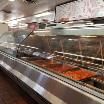 Kiki-D's - a display of food in a restaurant - Fast Food Near Me - Chicago, Illinois Kiki-D's - a display of food in a restaurant - Fast Food Near Me - Chicago, Illinois