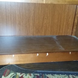 scratched up book shelf after move