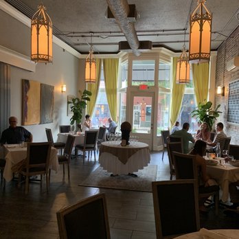 manna - people sitting at tables in a restaurant - New American Near Me - Wilmington, North Carolina
