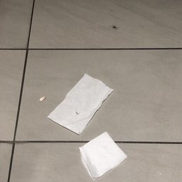 The women's bathroom .  A MESS , notice the fake nail and trash everywhere