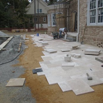 The King's Garden - installing travertine patio - Lawn Services Near Me - Toano, Virginia The King's Garden - installing travertine patio - Lawn Services Near Me - Toano, Virginia
